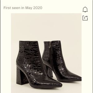 Shiny black detailing booties very cute.